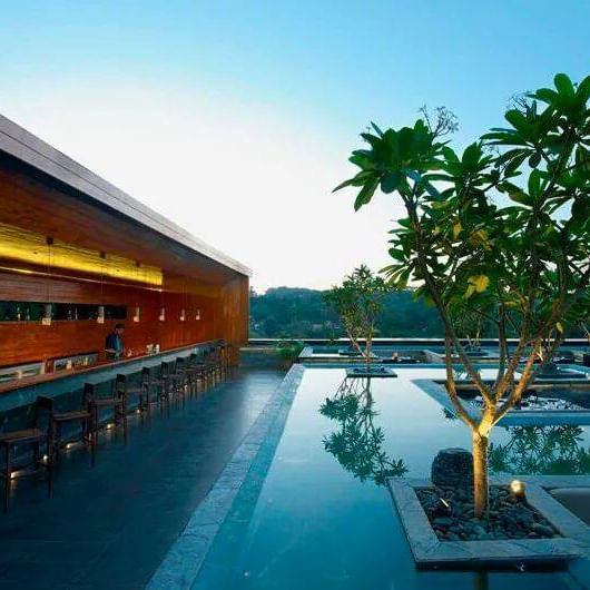 Resort,Swimming pool,Architecture,Building,Eco hotel,Leisure,Tree,Reflecting pool,House,Vacation