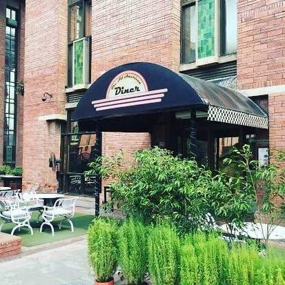 Property,Awning,Building,Real estate,Restaurant,House,Architecture,Home,Plant,Coffeehouse