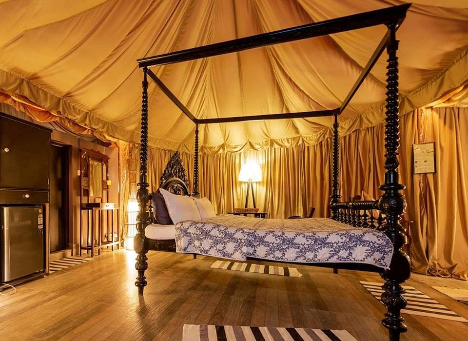 Canopy bed,Bed,Furniture,Bedroom,Room,four-poster,Property,Interior design,Building,Lighting