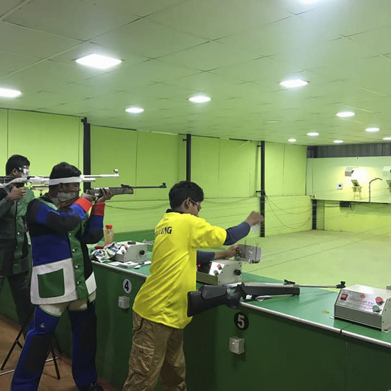 Shooting sport,Shooting,Recreation,Gun,Sports,Shooting range,Sport venue,Room,Individual sports,Air gun