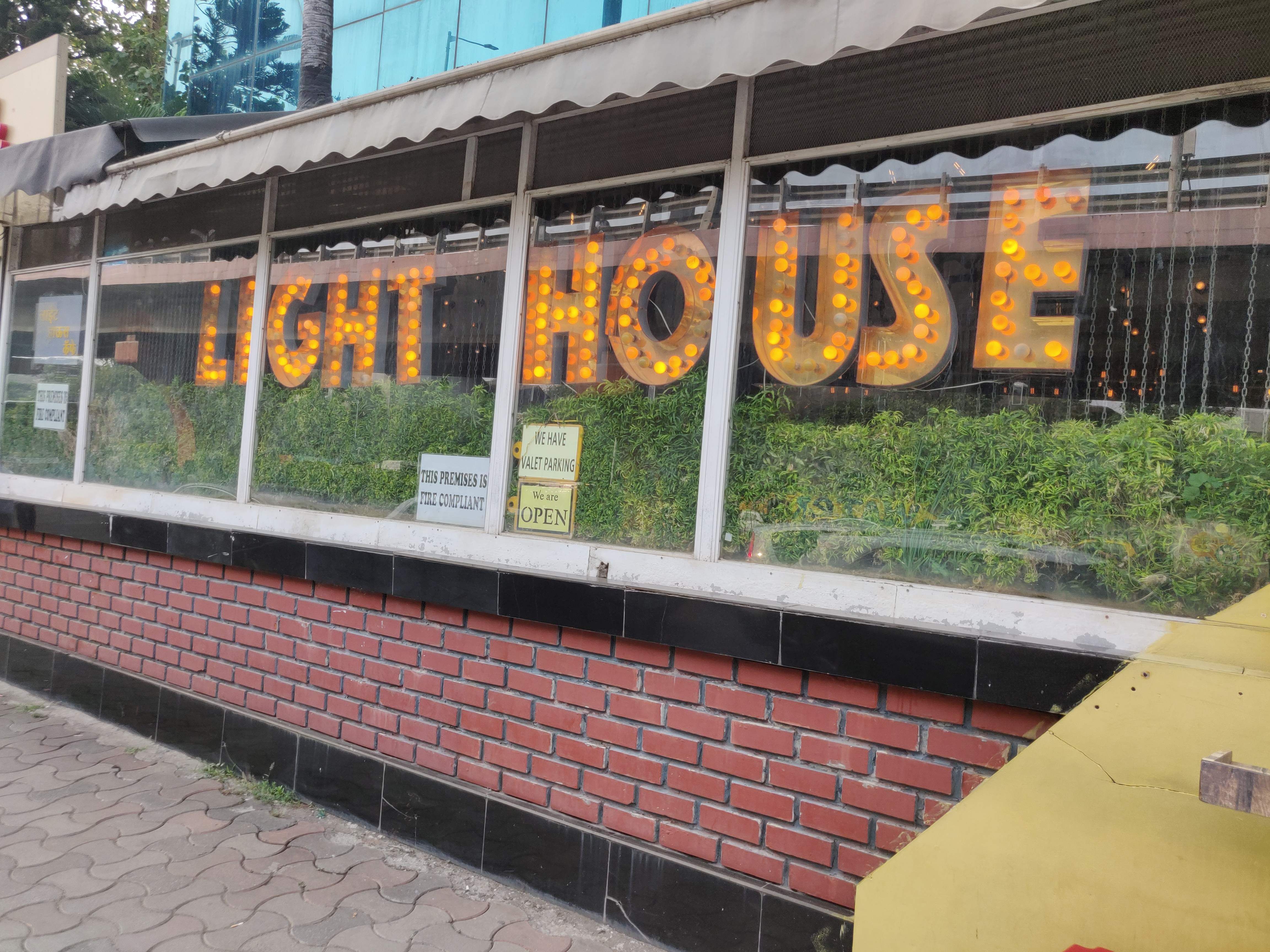 Orange,Banner,Advertising,Building,Stadium,Sport venue,Art