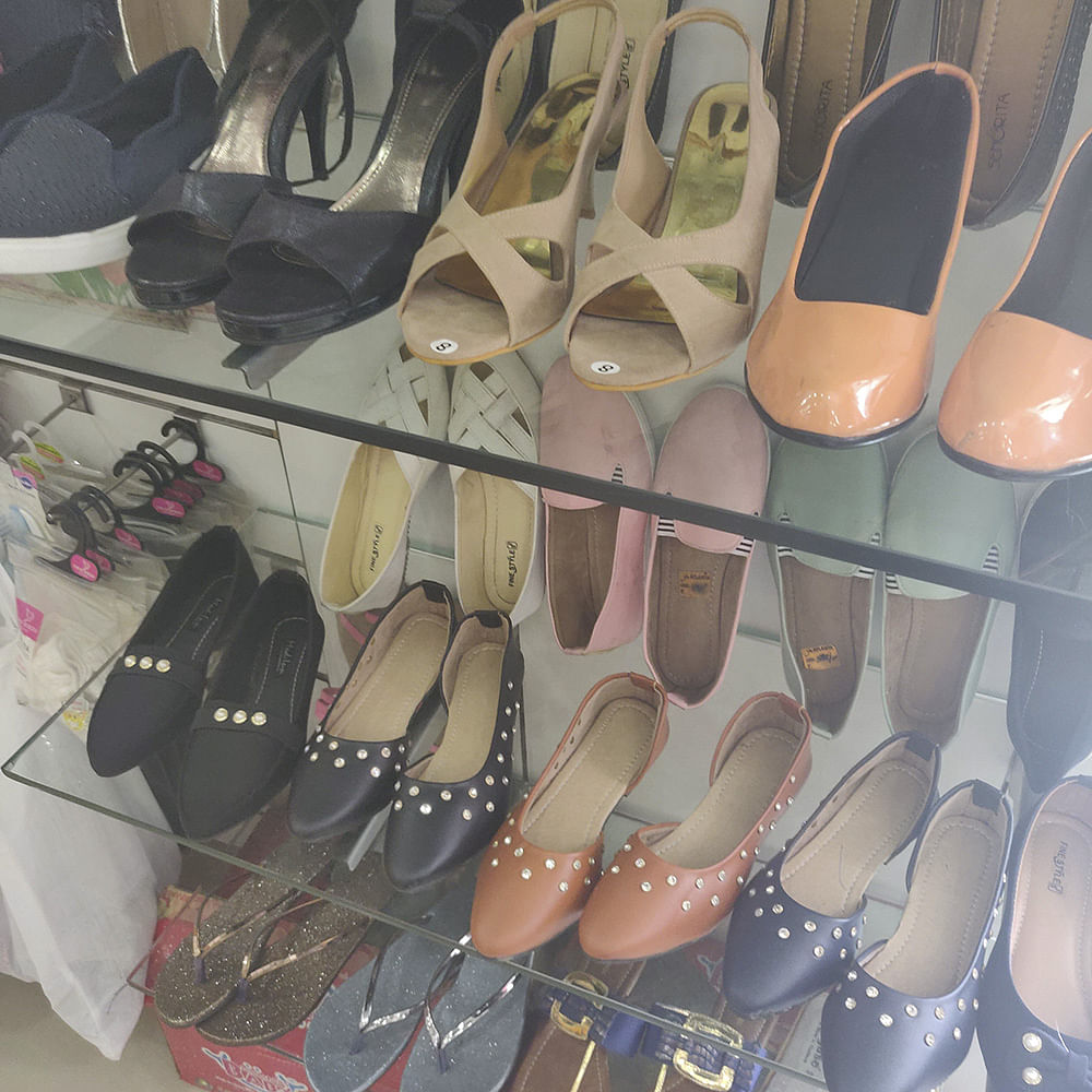 Footwear,Shoe,Shoe store,High heels,Sandal,Ballet flat,Court shoe,Slipper,Pointe shoe,Leather