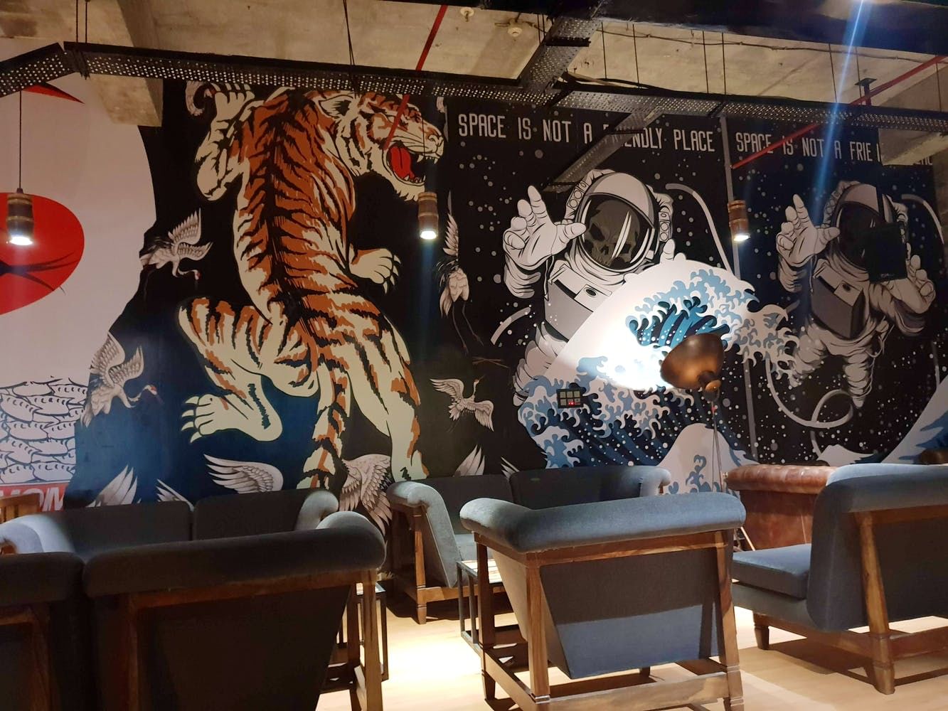Wall,Room,Mural,Interior design,Tiger,Art,Design,Restaurant,Table,Felidae