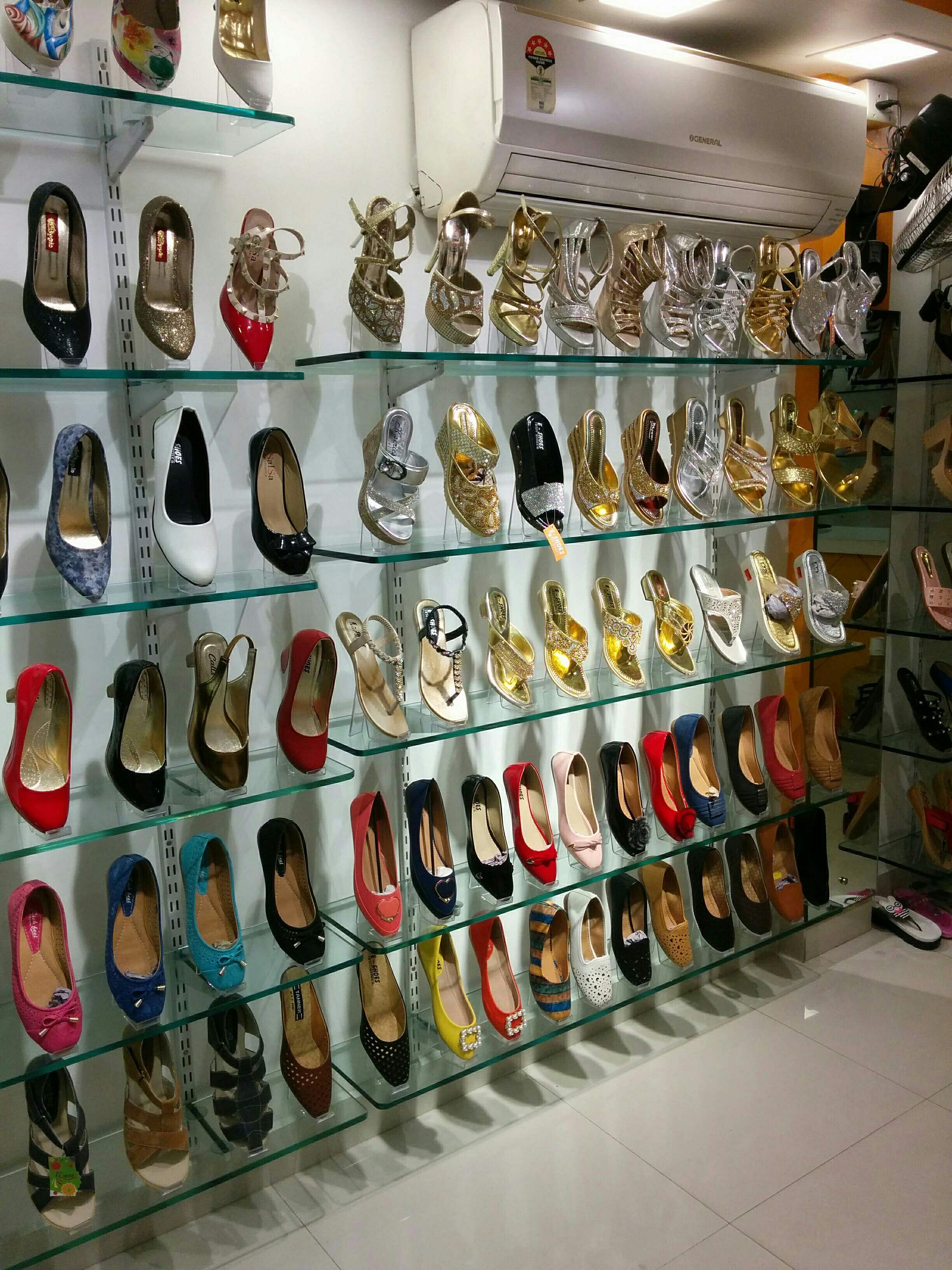 Footwear,Collection,Shoe store,Shoe,Display case,Outlet store,Room,Boutique,Fashion accessory,Athletic shoe