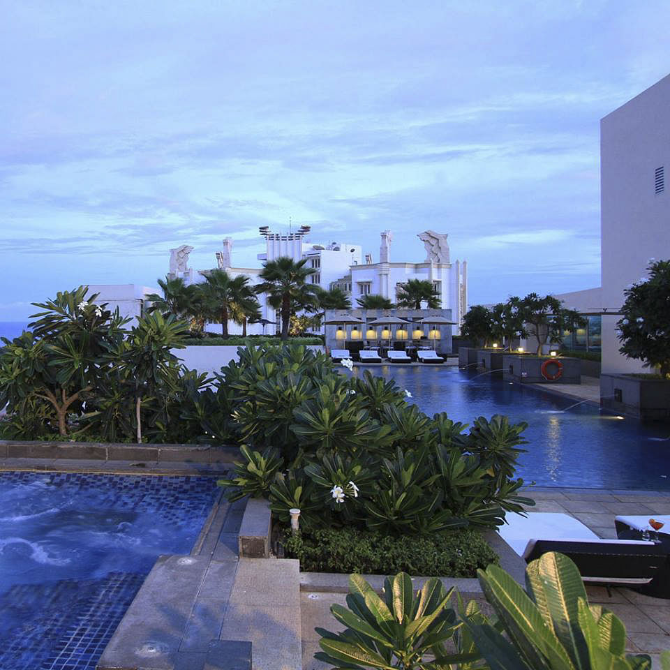 Swimming pool,Sky,Resort,Tree,Palm tree,Vacation,Water,Real estate,Architecture,Arecales