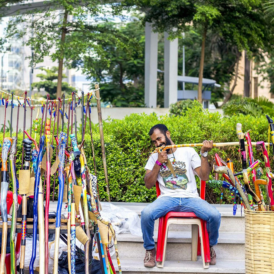 Red,Yellow,Tree,Street fashion,Leisure,Sitting,Fun,Street,Street performance,Vacation