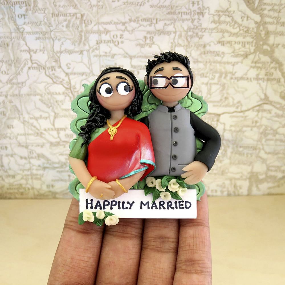 Cartoon,Green,Action figure,Animation,Figurine,Toy,Font,Fictional character,Glasses,Finger