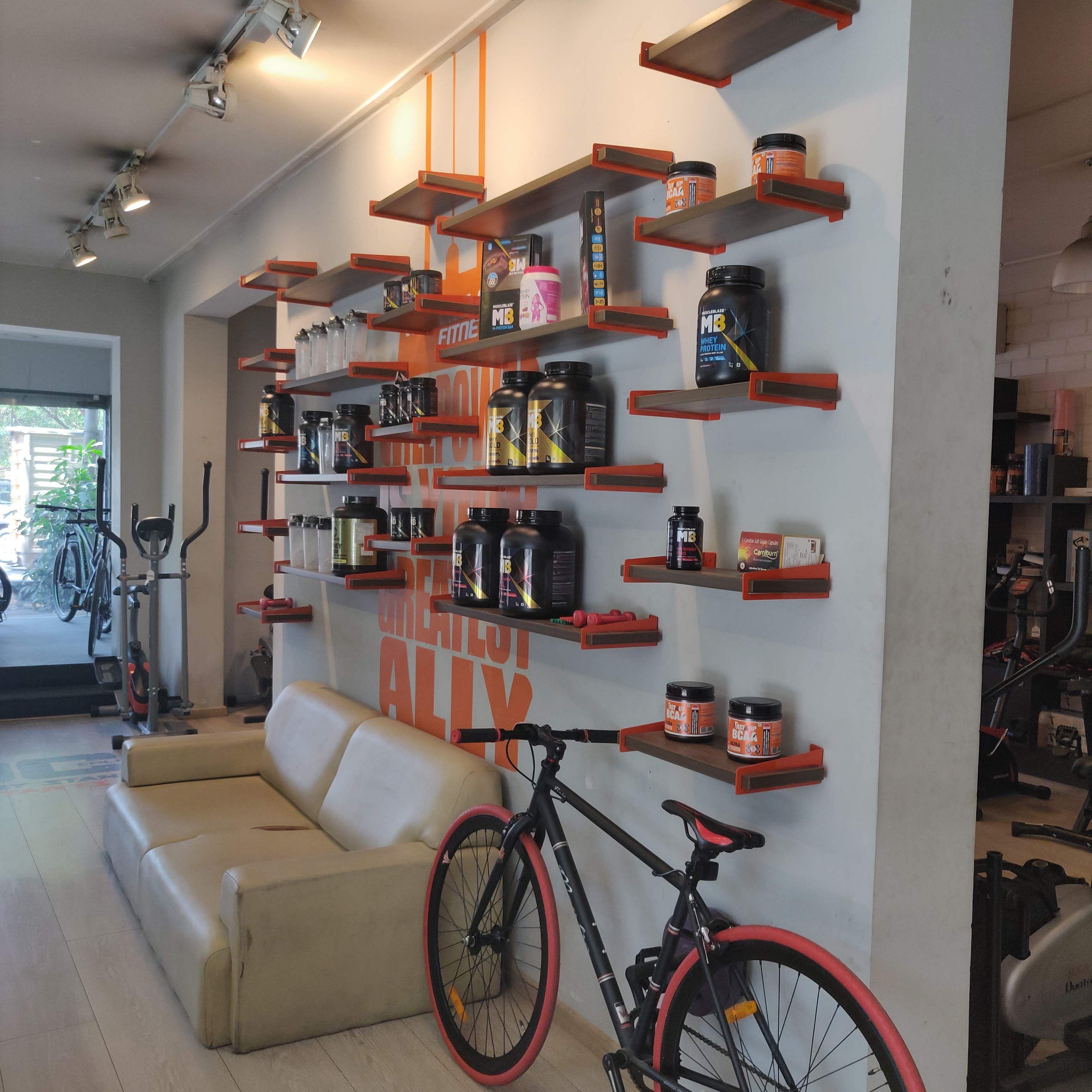 Shelf,Shelving,Bicycle wheel,Bicycle,Room,Building,Bicycle fork,Vehicle,Bicycle part,Interior design
