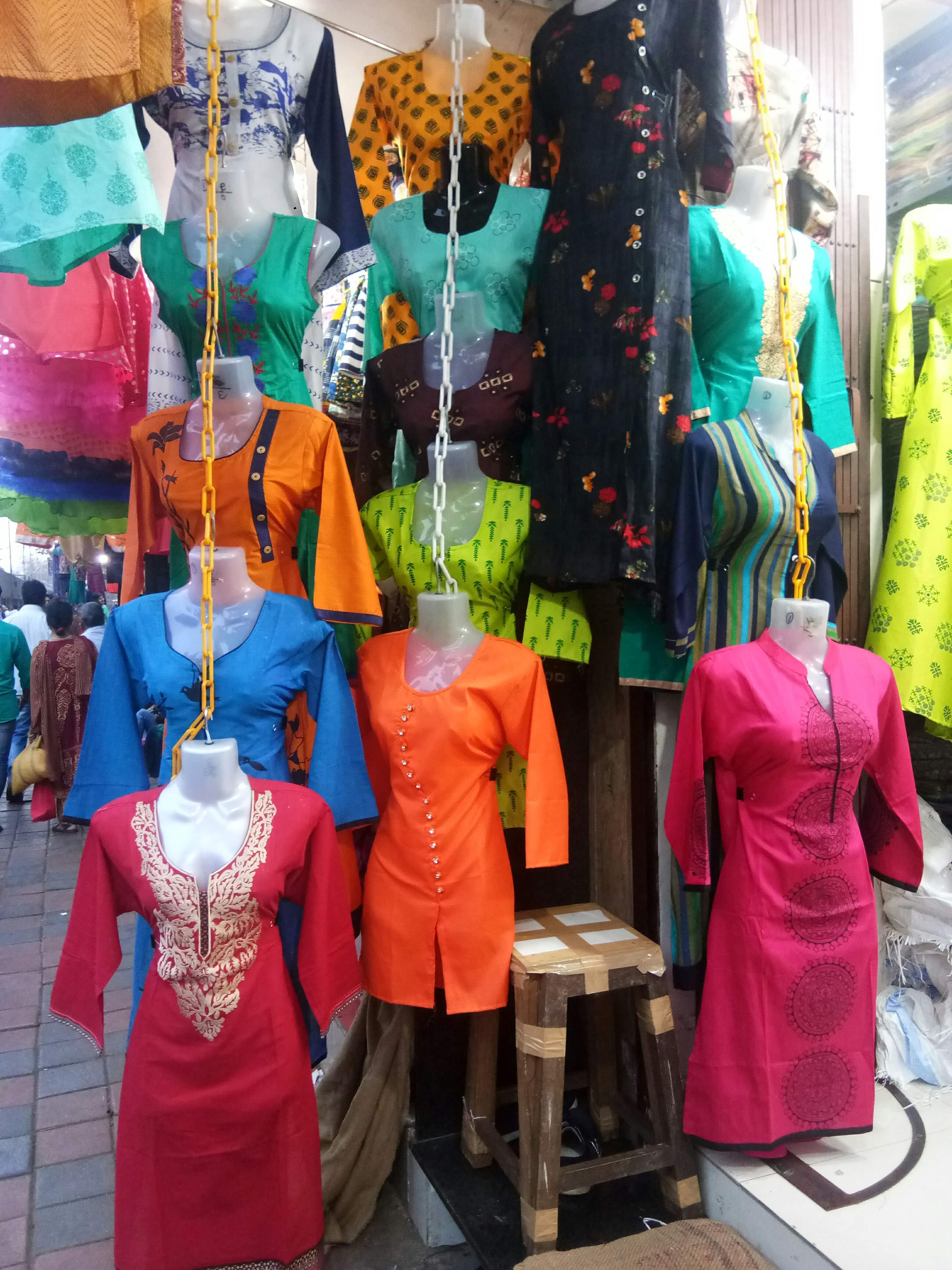 Bazaar,Public space,Selling,Display window,Retail,Market,Temple,Mannequin,Textile,Shopping