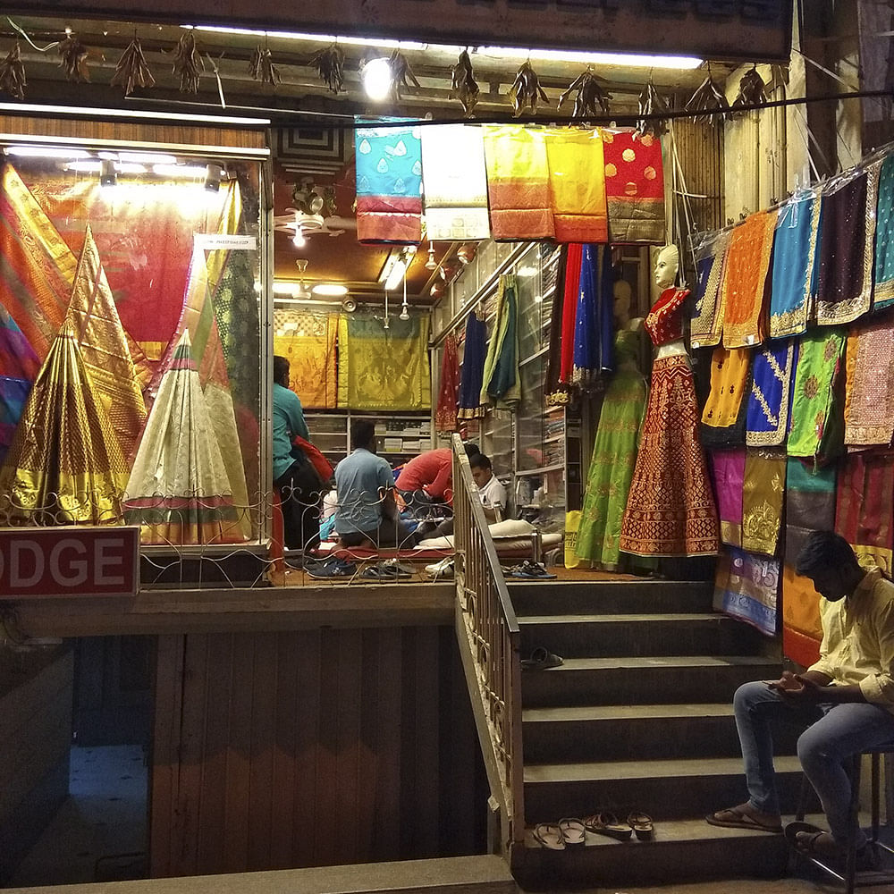 Market,Public space,Bazaar,Marketplace,Human settlement,Textile,Selling,City,Building,Street