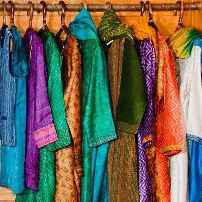 Clothing,Silk,Textile,Clothes hanger,Boutique,Stole,Room,Fashion design,Outerwear,Sari