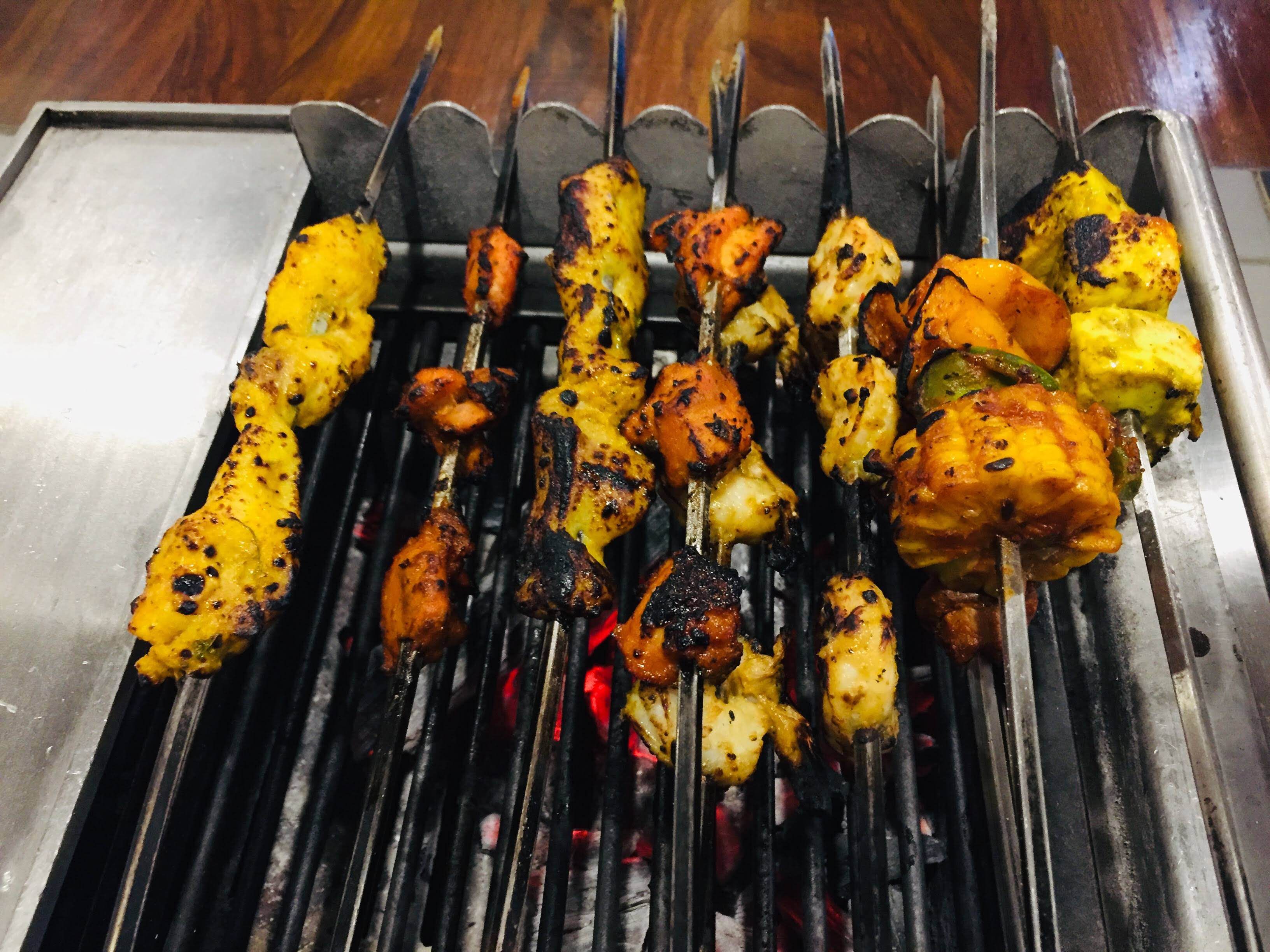 Barbecue,Grilling,Barbecue grill,Food,Dish,Roasting,Cooking,Cuisine,Satay,Outdoor grill