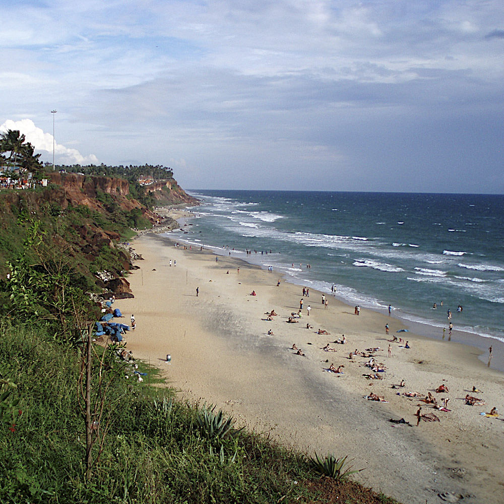 Body of water,Beach,Coast,Sky,Shore,Sea,Ocean,Coastal and oceanic landforms,Natural environment,Cloud