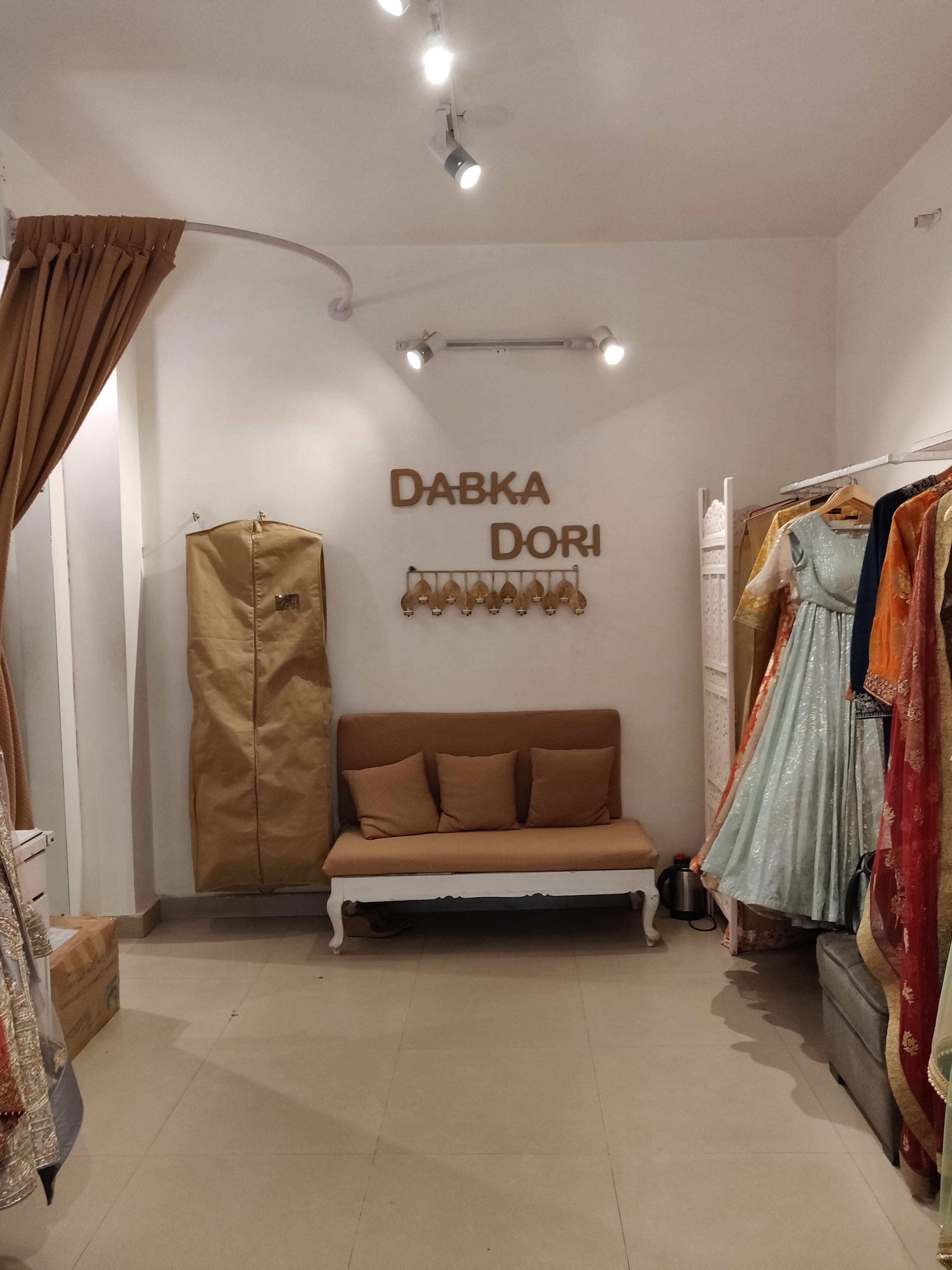 Room,Interior design,Property,Furniture,Ceiling,Boutique,Floor,Lighting,Building,Dress