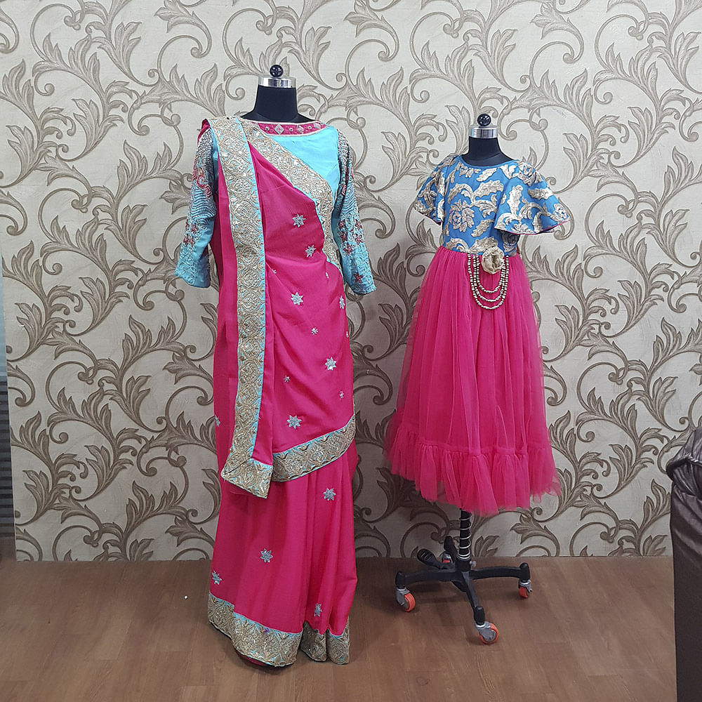 Clothing,Pink,Formal wear,Magenta,Turquoise,Dress,Aqua,Fashion design,Textile,Outerwear