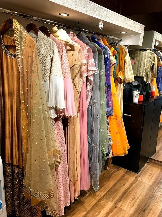 Boutique,Clothing,Room,Clothes hanger,Closet,Outlet store,Fashion,Textile,Dress,Furniture