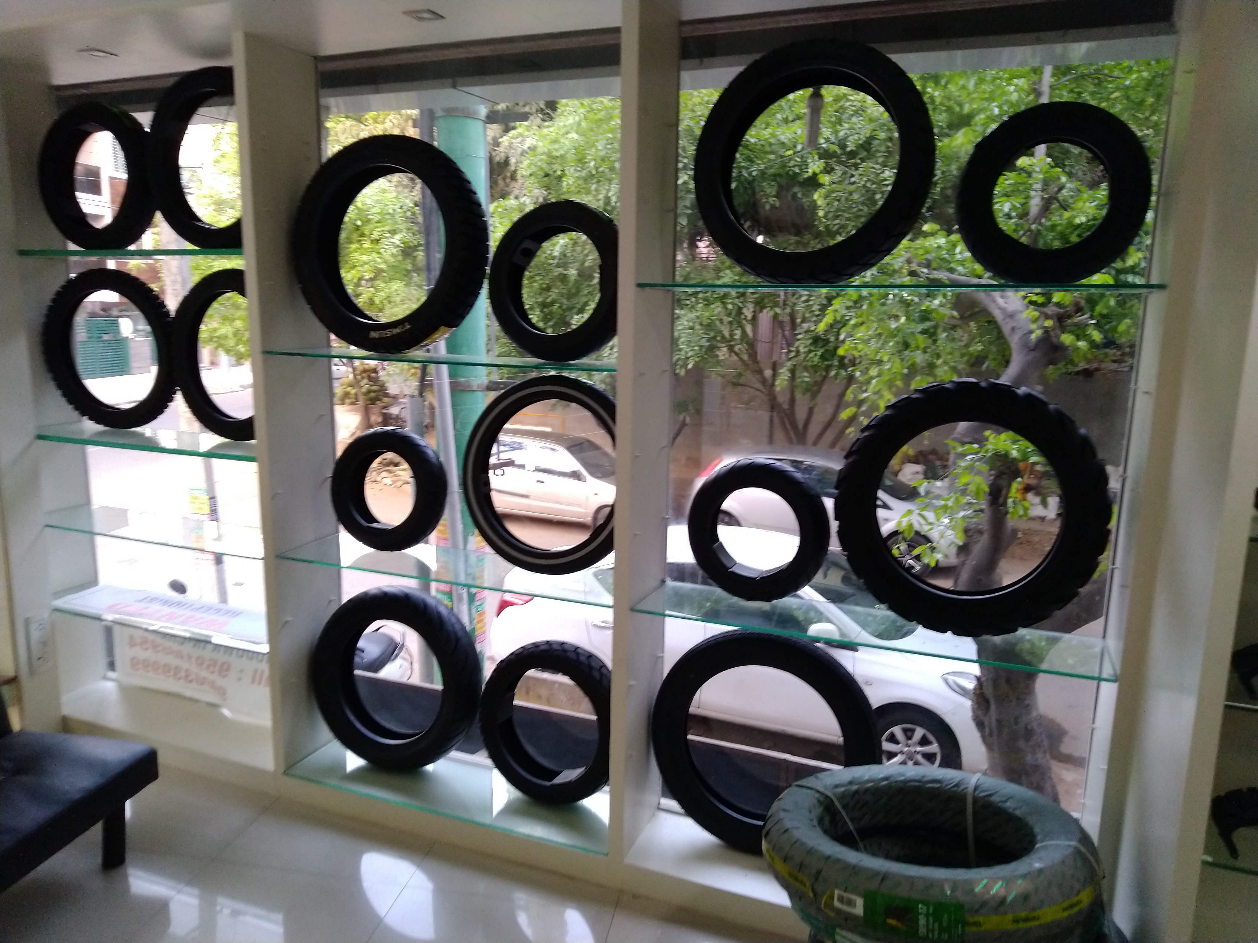 Tire,Automotive tire,Room,Window,Automotive wheel system,Auto part,Rim,Interior design,Circle,Wheel