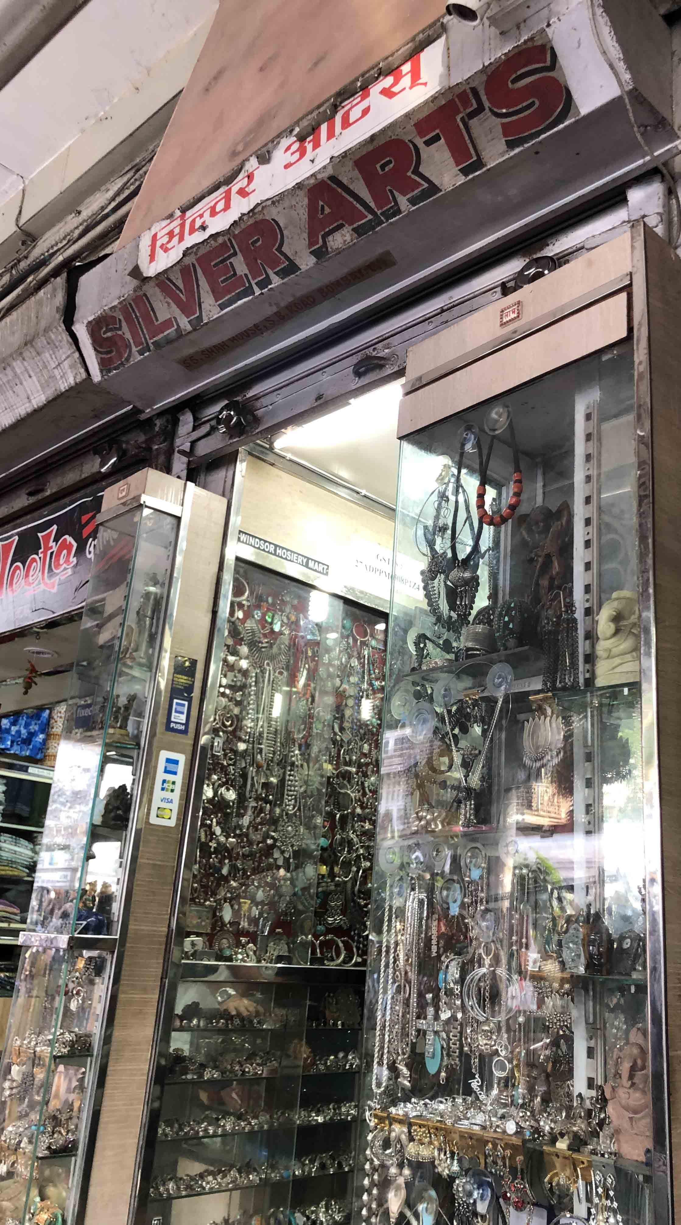 Building,Urban area,Architecture,Facade,City,Real estate,Glass,Retail,Commercial building,Street