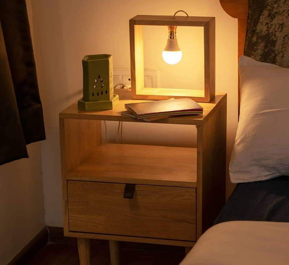 Furniture,Nightstand,Room,Lighting,Table,Light fixture,Interior design,Dresser,Chest of drawers,Drawer
