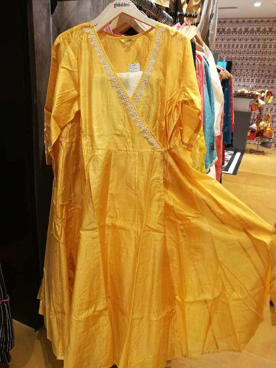 Clothing,Yellow,Dress,Fashion,Outerwear,Costume design,Fashion design,Textile,Costume,Boutique