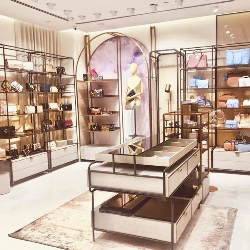 Building,Eyewear,Display case,Interior design,Furniture,Boutique,Retail,Room,Shoe store,Footwear