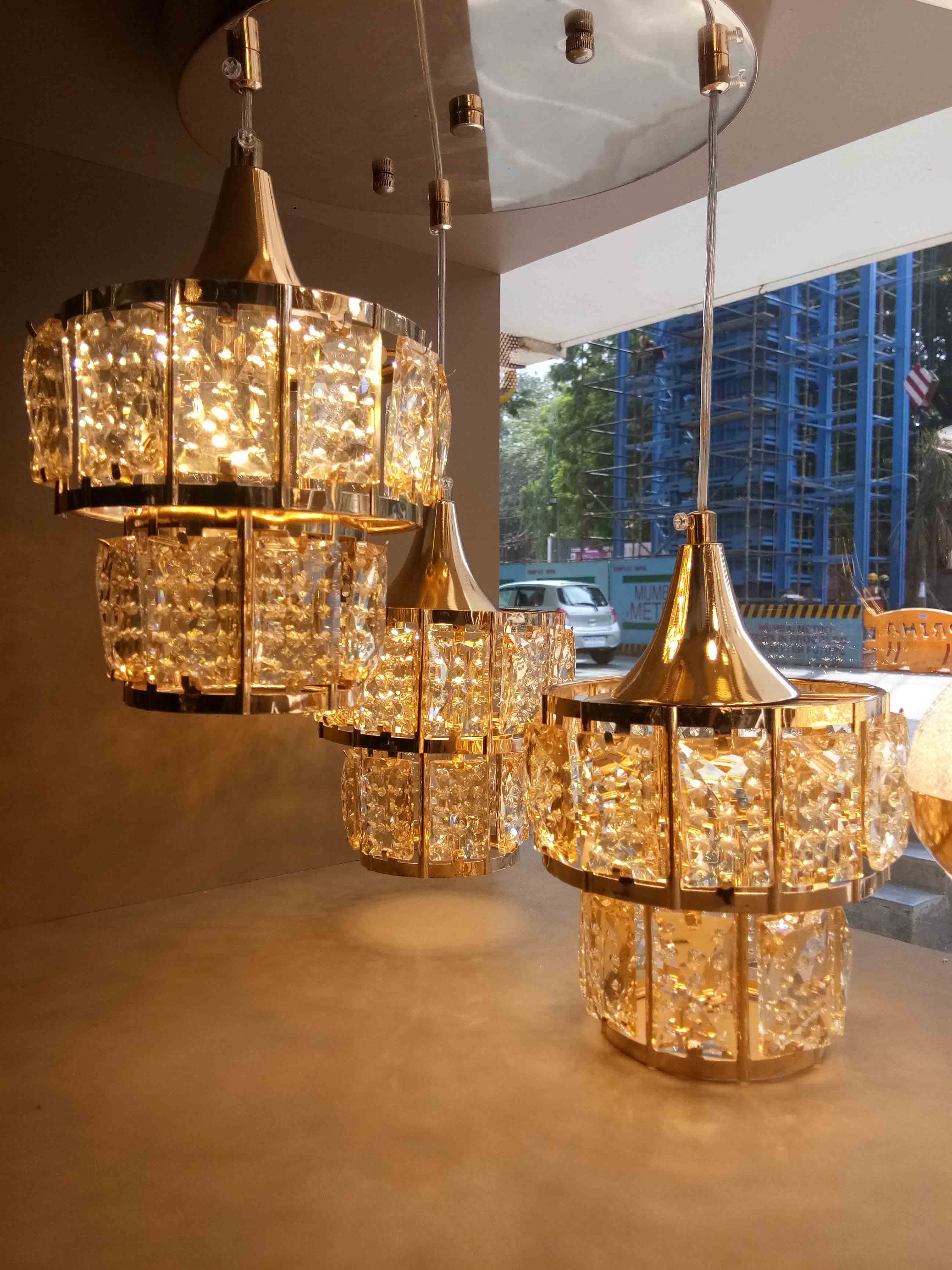 Light fixture,Lighting,Chandelier,Lamp,Lighting accessory,Lampshade,Room,Interior design,Ceiling,Interior design