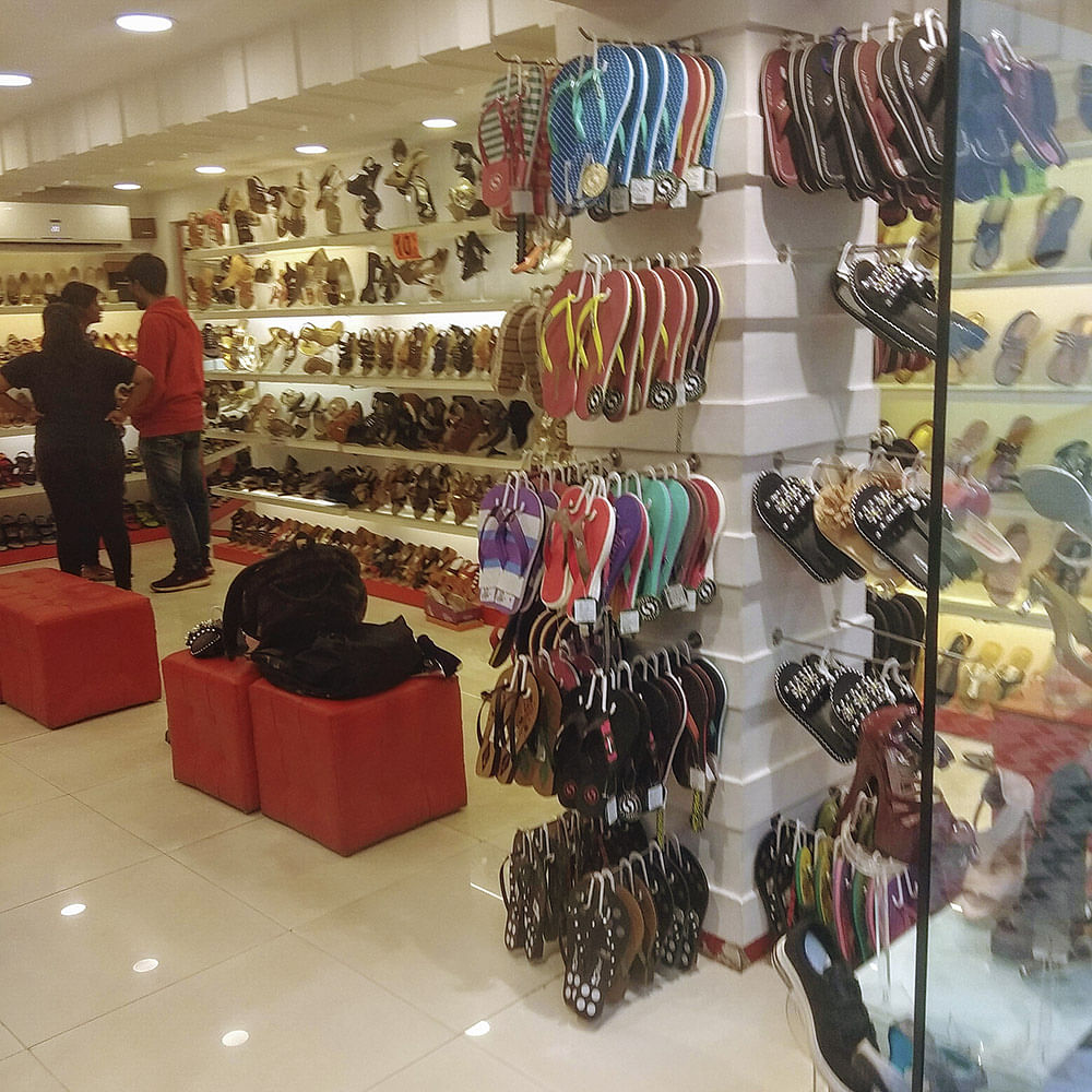 Footwear,Outlet store,Boutique,Shoe,Retail,Collection,Athletic shoe,High heels,Building,Fashion accessory