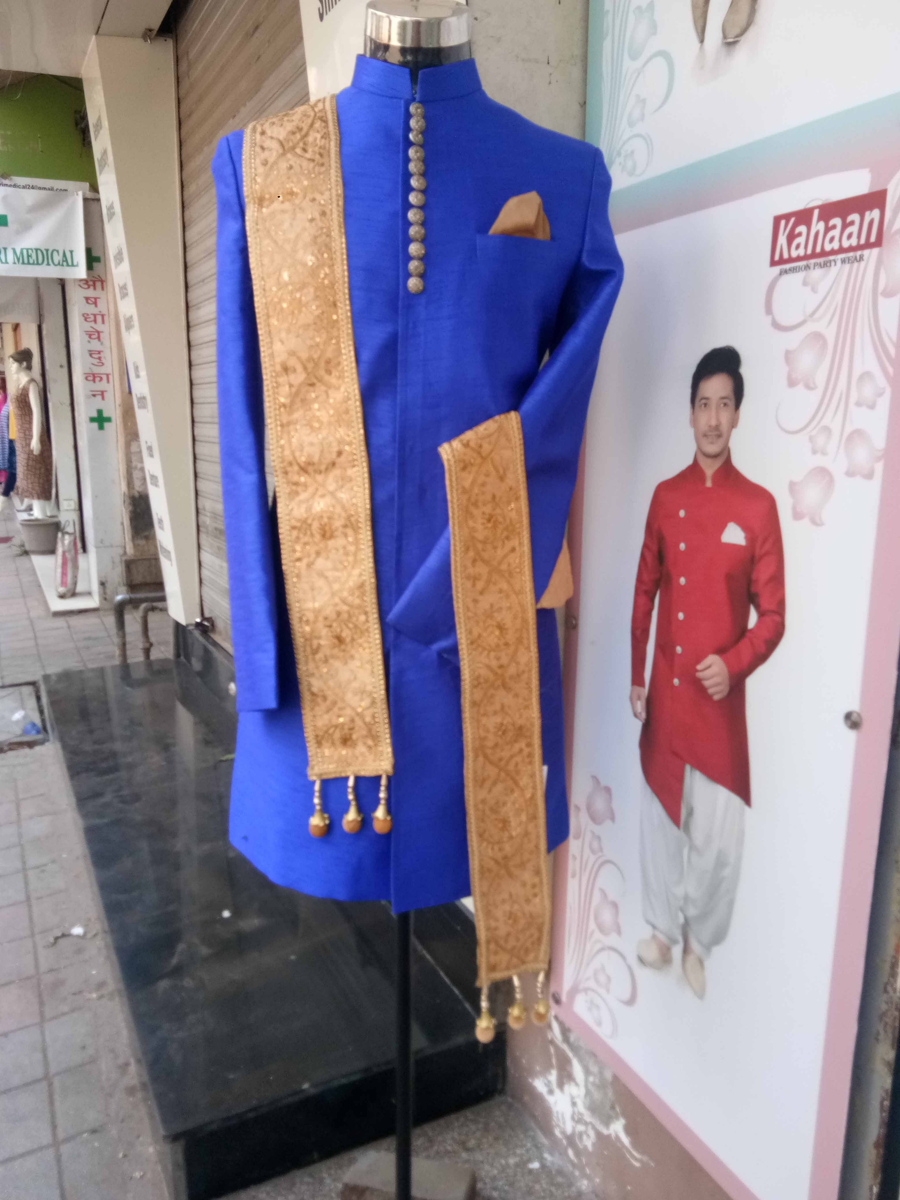 Blue,Standing,Outerwear,Textile,Formal wear,Mannequin,Suit,Boutique,Fashion design,World