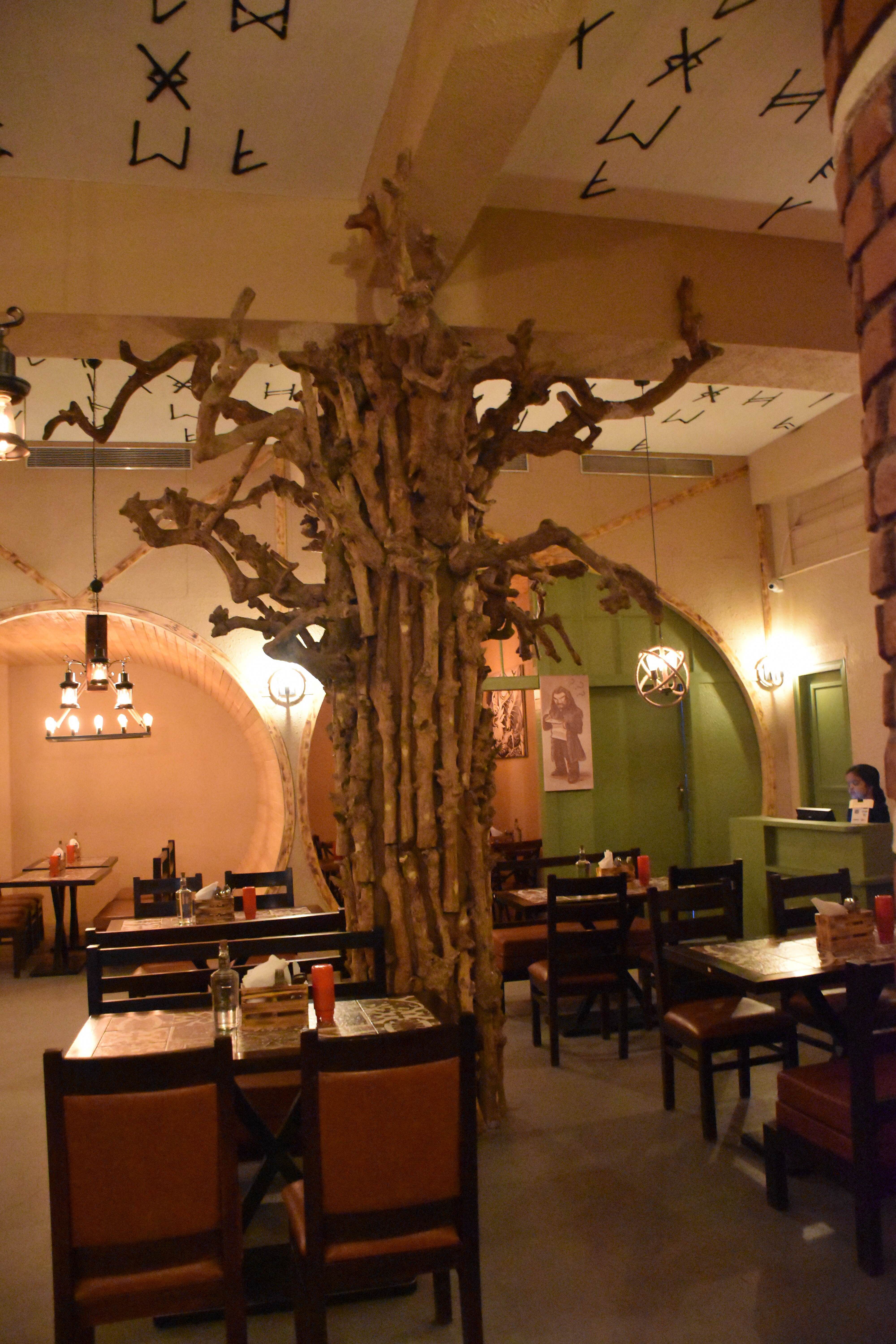 Restaurant,Building,Interior design,Room,Café,Tree,Table,Business,Coffeehouse,Organization