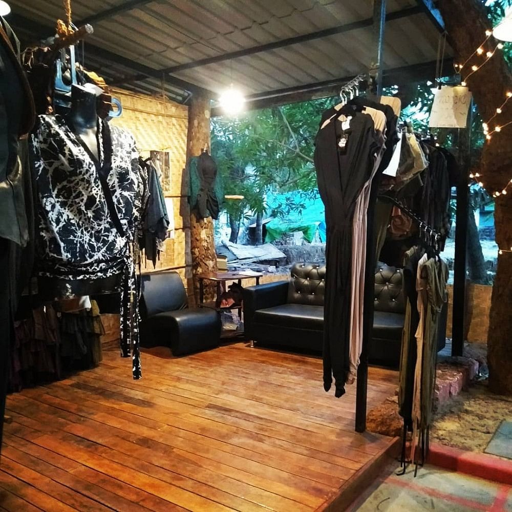 Iron,Boutique,Room,Wood,Building,Tree,Interior design,Floor,Hardwood,Sportswear