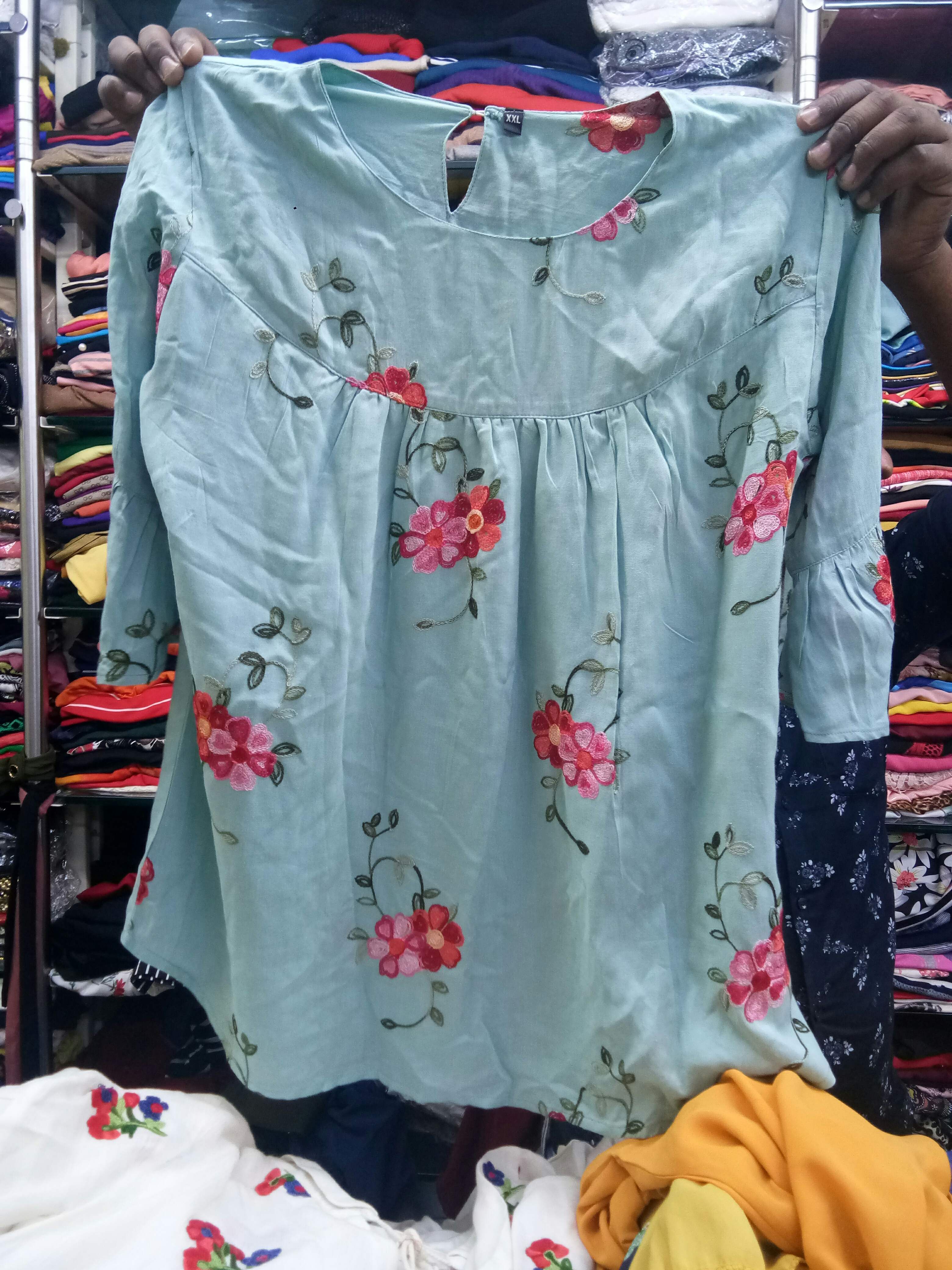 Clothing,T-shirt,Dress,Textile,Technology,Sleeve,Footwear,Electronic device,Shirt,Top