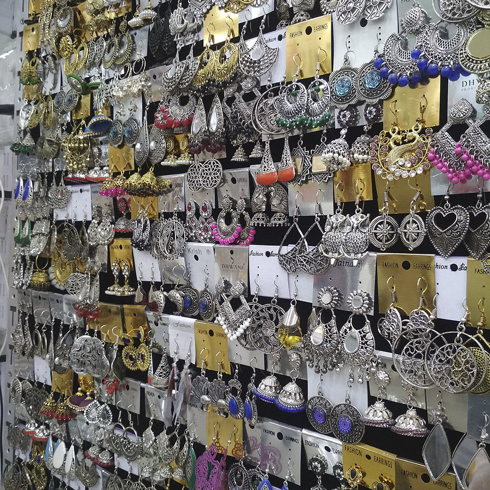 Wall,Footwear,Fashion accessory,Collection,Photography,Metal