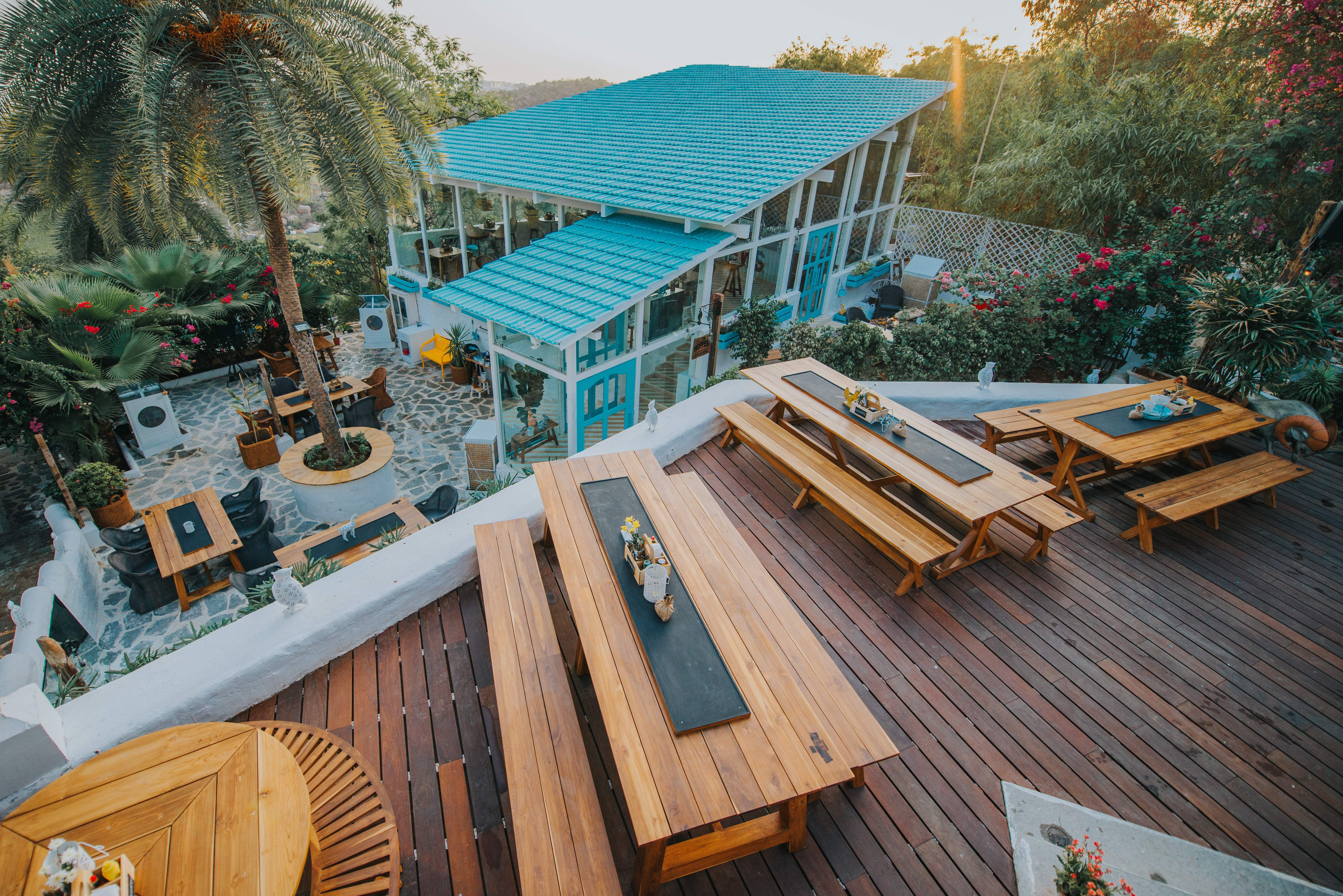 Deck,Roof,House,Architecture,Wood,Home,Table,Building,Real estate,Furniture