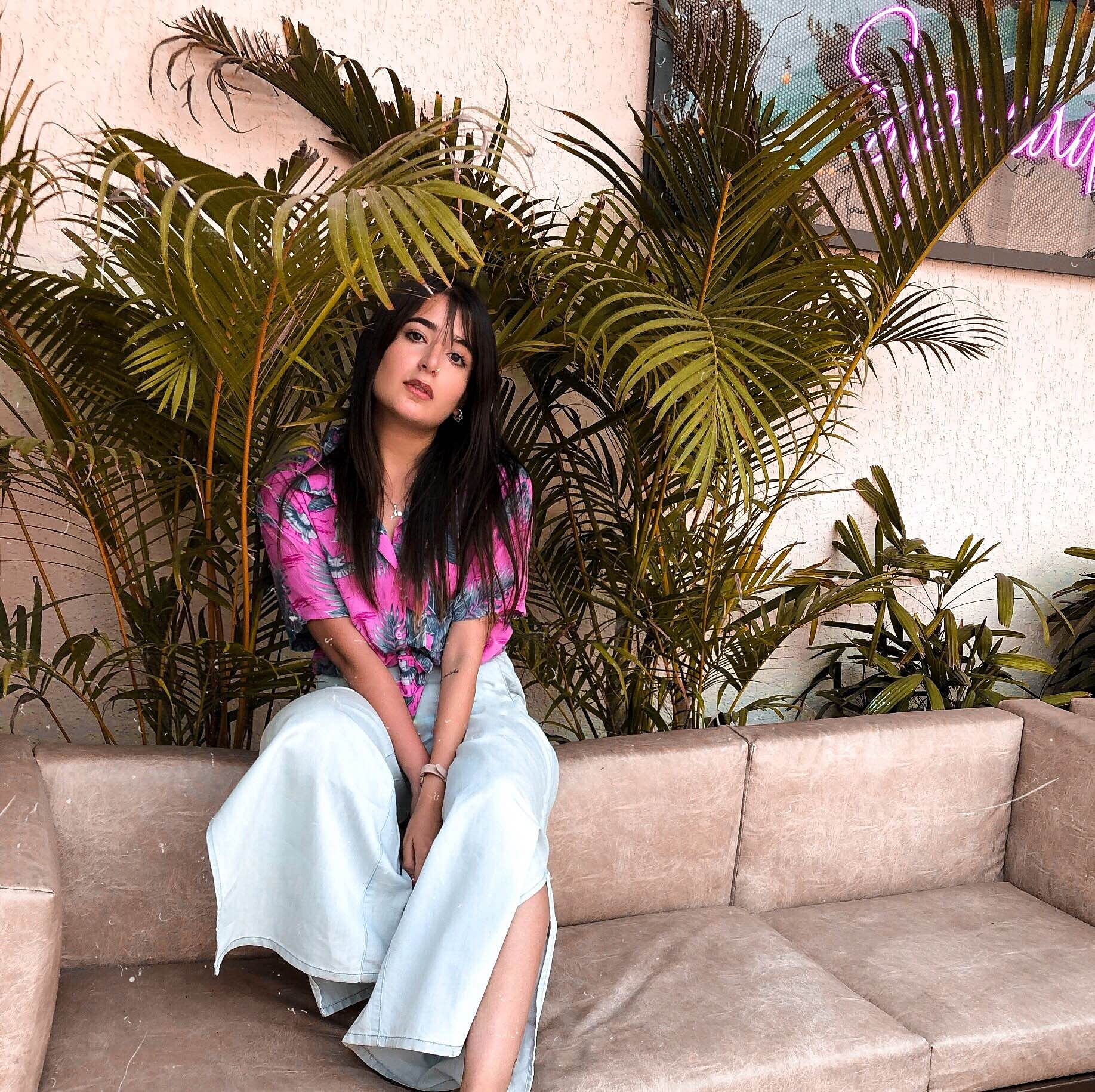 Pink,Beauty,Skin,Leg,Sitting,Fashion,Long hair,Dress,Plant,Magenta