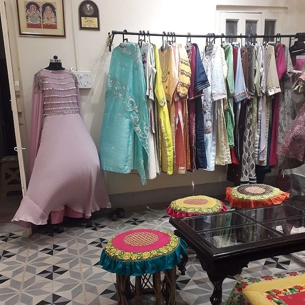 Boutique,Room,Clothing,Pink,Dress,Furniture,Fashion,Closet,Textile,Interior design