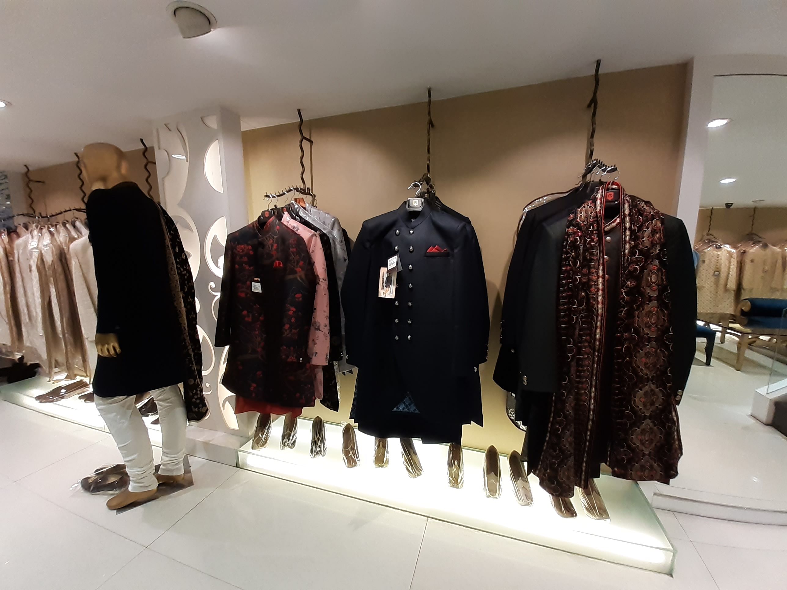 Boutique,Fashion,Outerwear,Clothes hanger,Fashion design,Display window,Footwear,Room,Retail,Collection