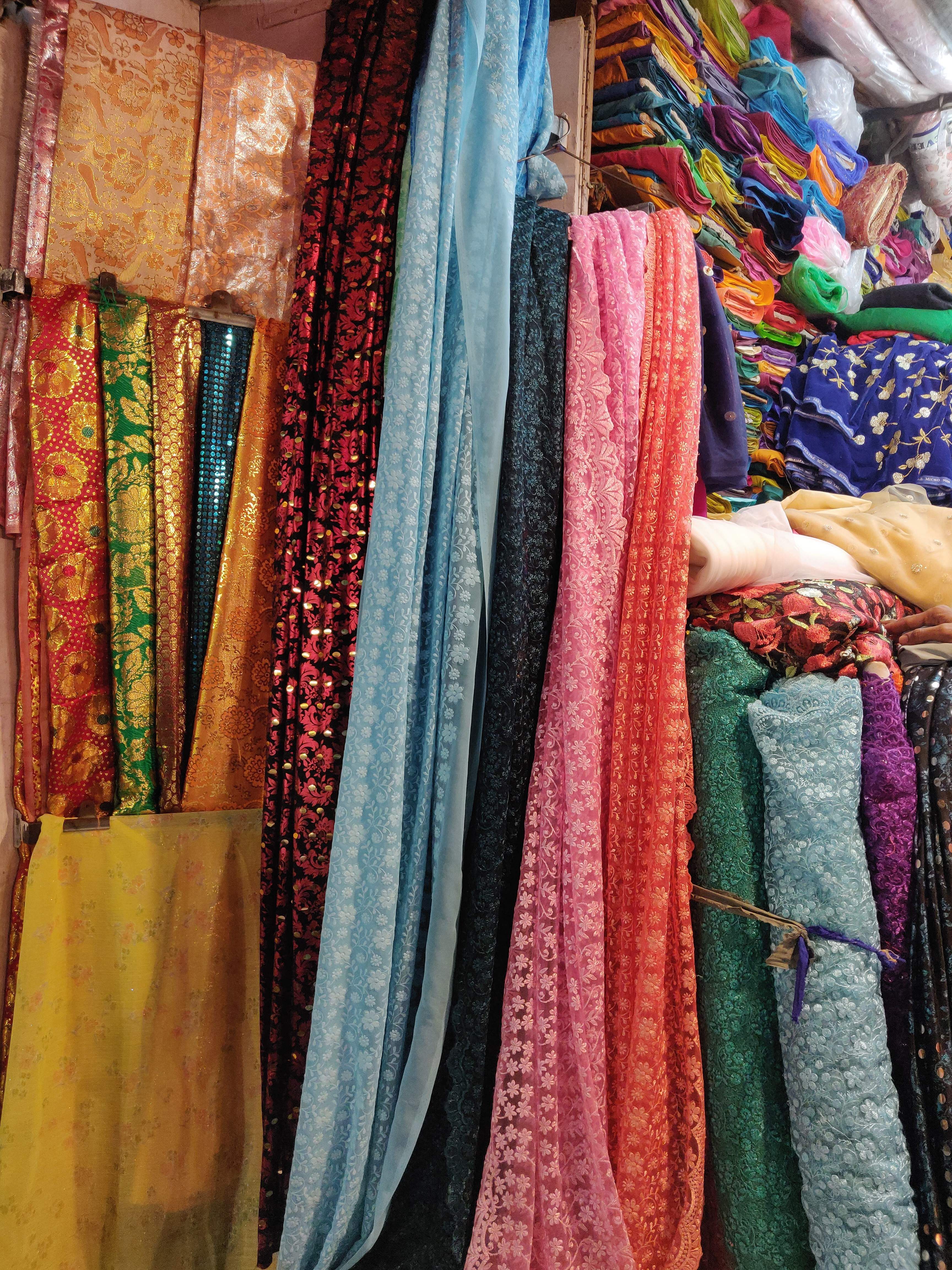 Clothing,Textile,Room,Woven fabric,Boutique,Bazaar,Market,Linens,Magenta,Sari