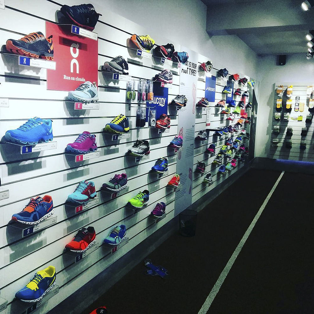 Footwear,Sportswear,Display case,Shelf,Shoe,Shoe store,Athletic shoe,Room,Architecture,Building