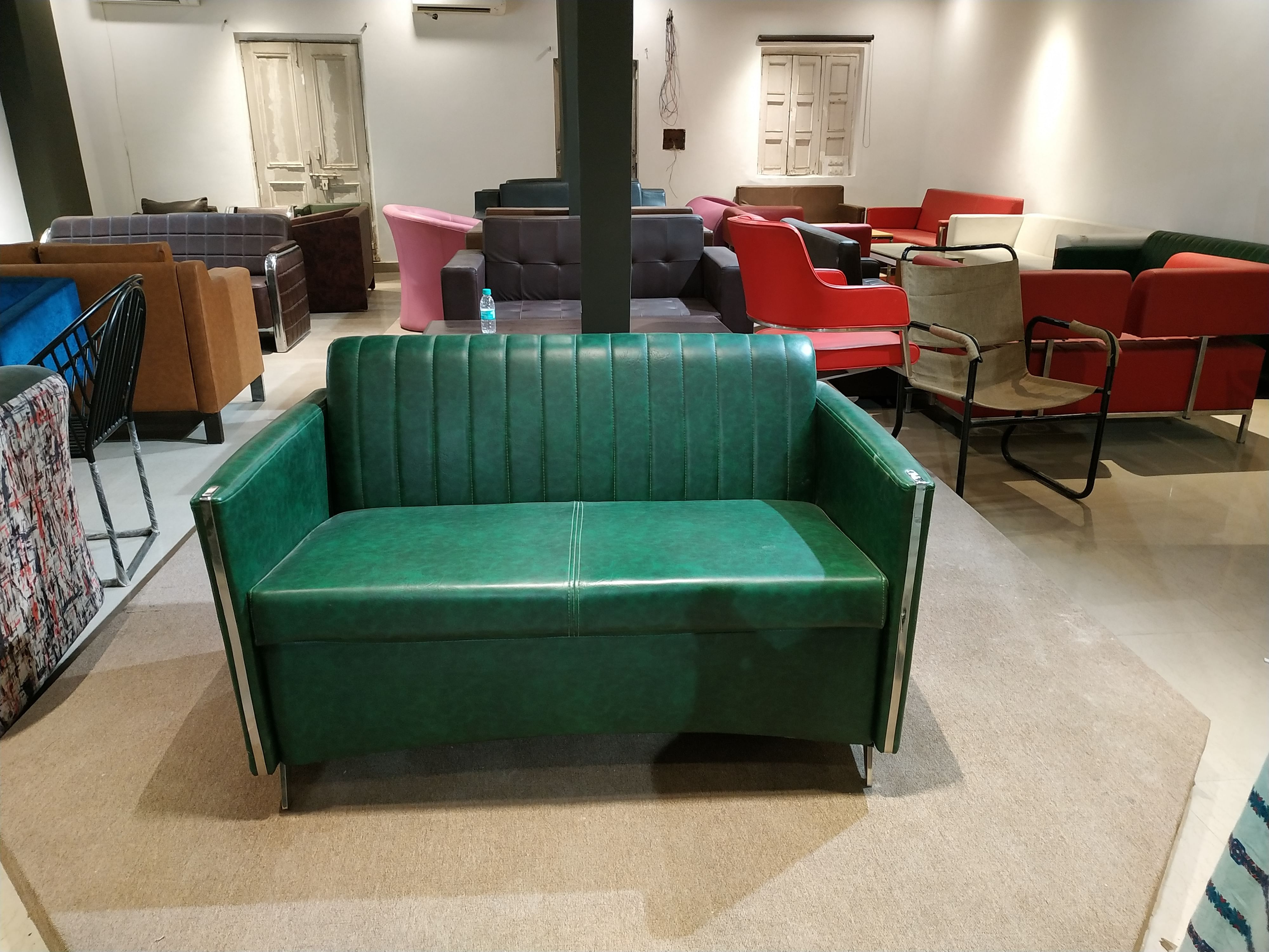 Green,Furniture,Room,Property,Couch,Interior design,Table,Waiting room,Architecture,Floor