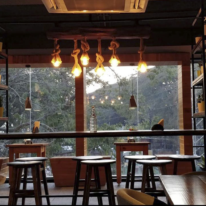 Restaurant,Lighting,Room,Interior design,Table,Building,Ceiling,Dining room,Café,Furniture