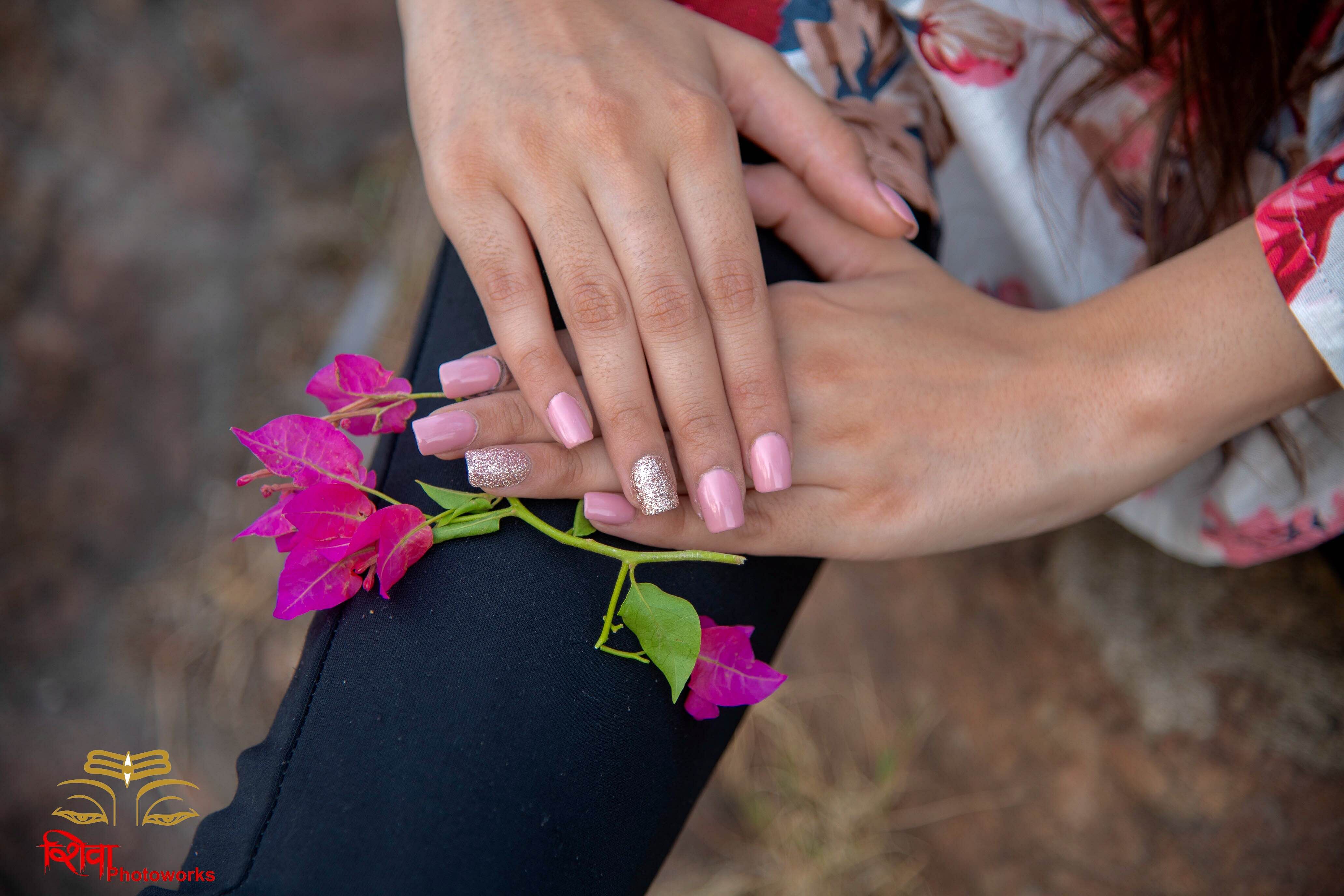 Nail,Pink,Flower,Hand,Finger,Plant,Floral design,Nail care,Magenta,Floristry