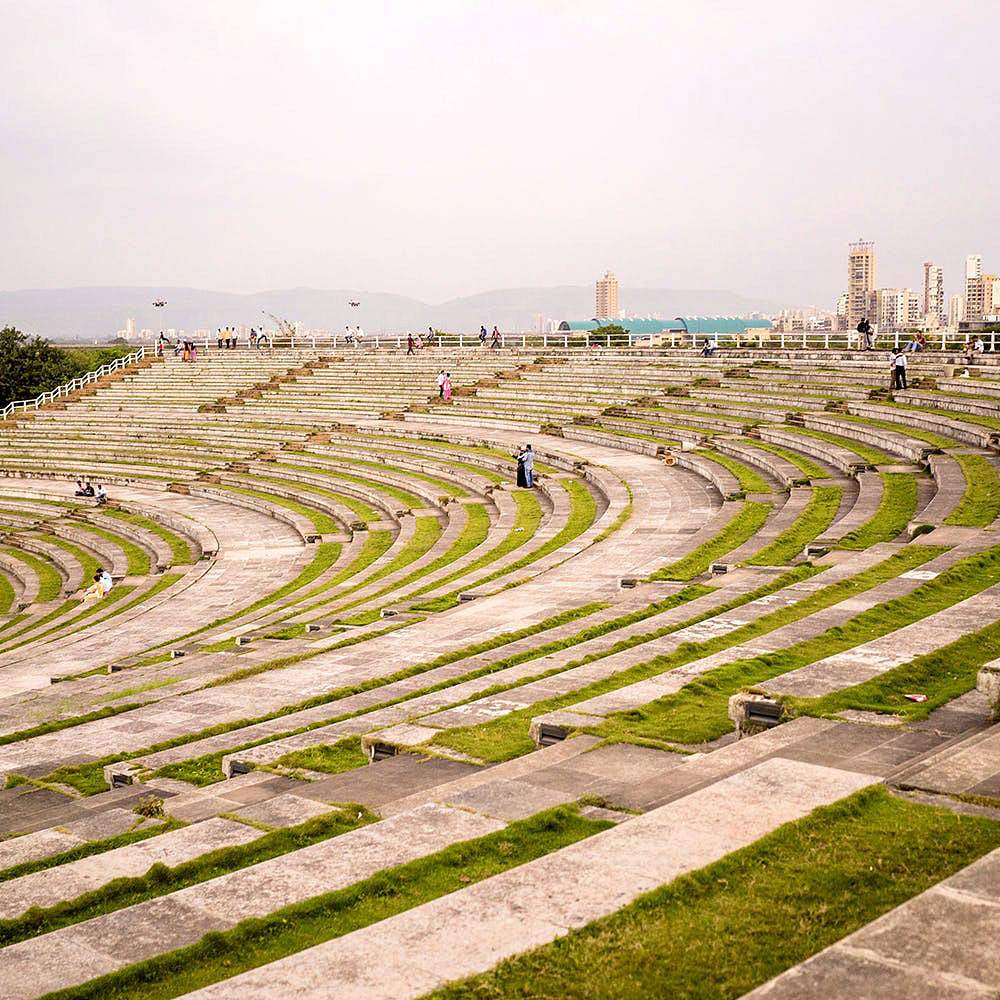 Grass,Landscape,Architecture,Urban design,Amphitheatre,Plant,Thoroughfare,Building,Sport venue,Race track