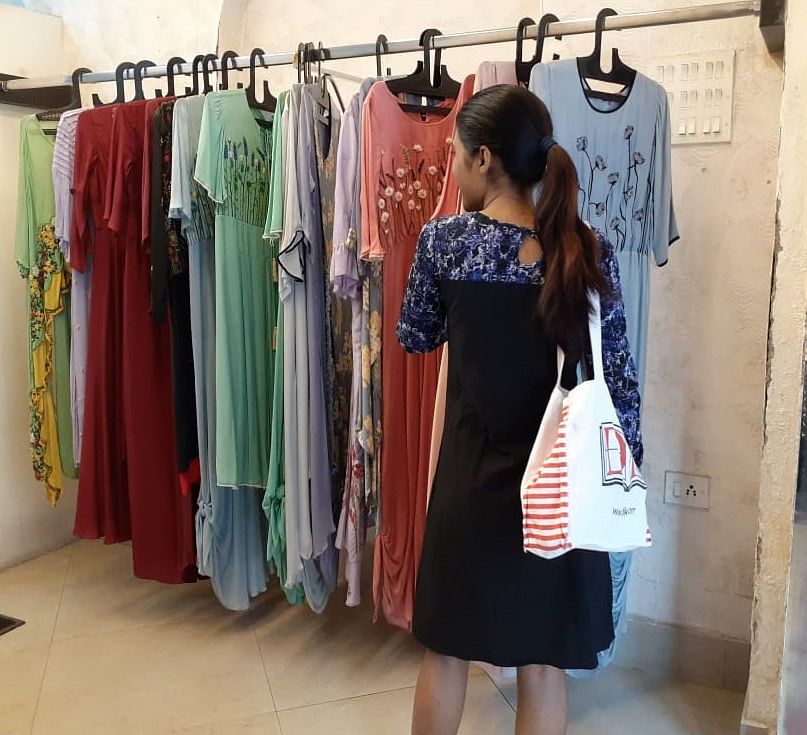 Clothing,Boutique,Clothes hanger,Dress,Outerwear,Vintage clothing,Room,Fashion design,Shopping,Street fashion