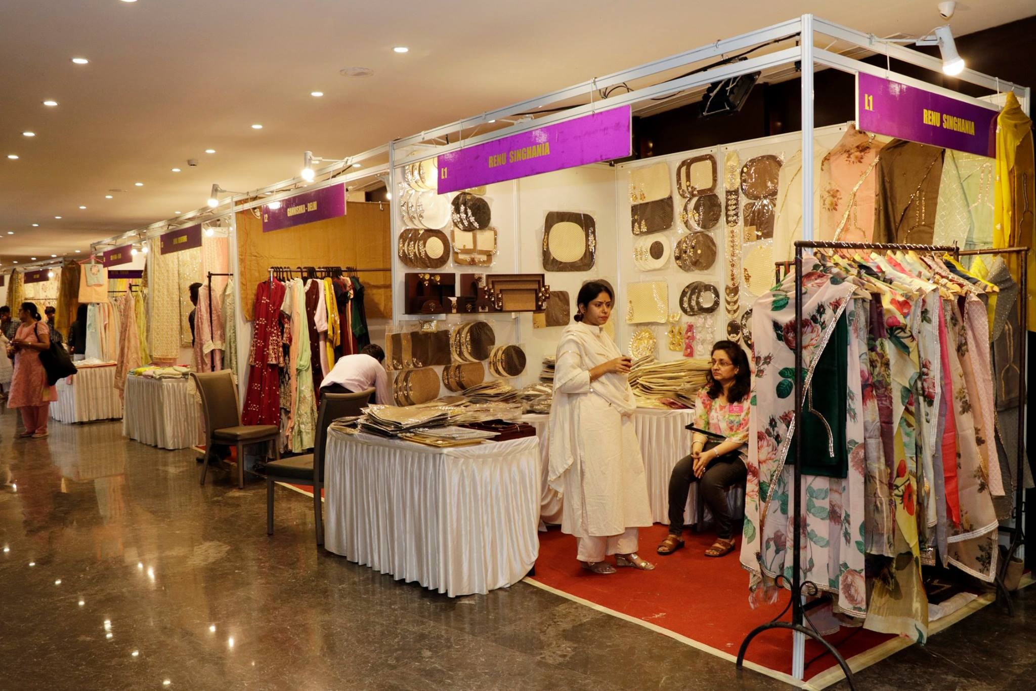 Boutique,Fashion,Outlet store,Building,Interior design,Room,Dress,Textile,Event,Retail
