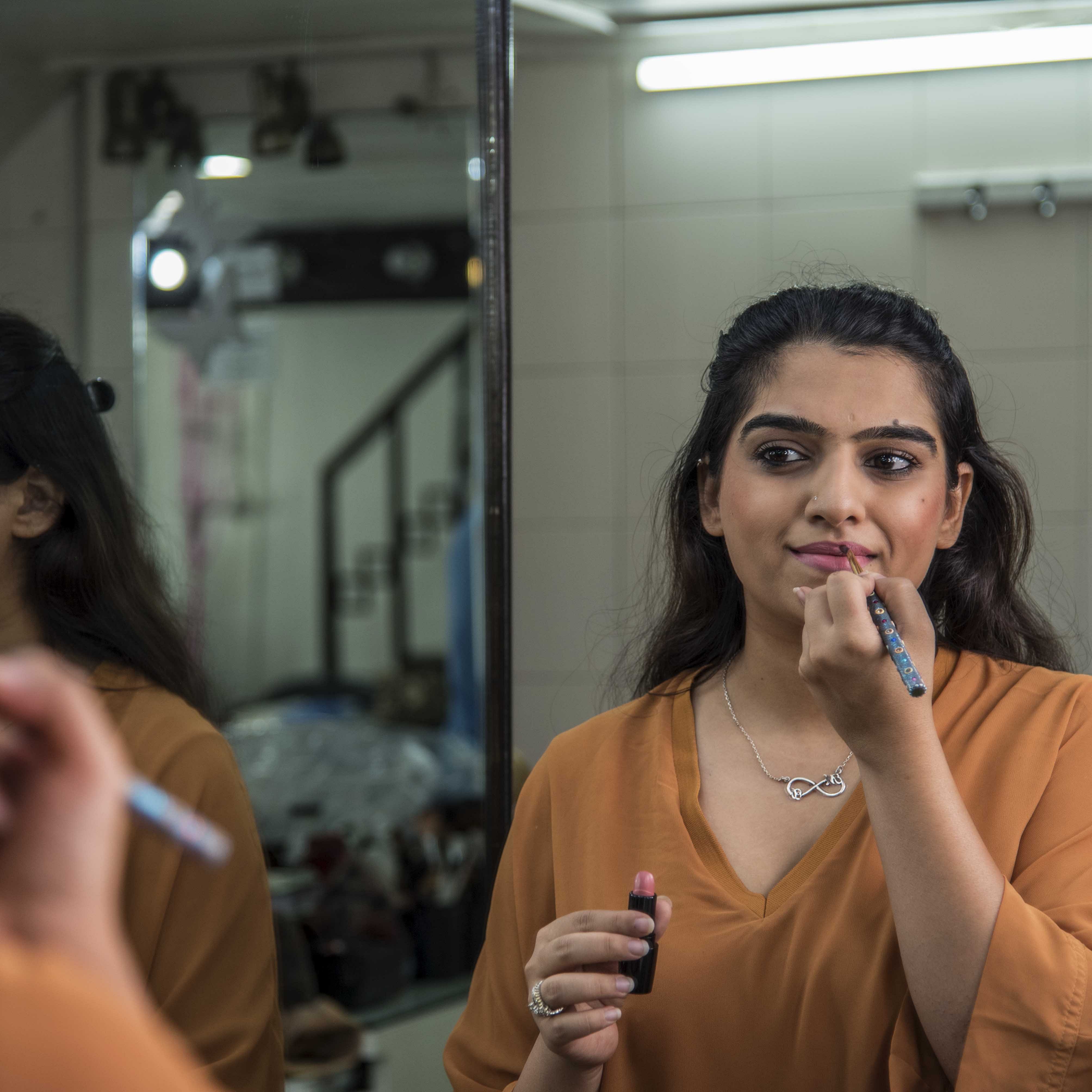 Lip,Beauty,Mouth,Nail,Room,Long hair,Finger,Tooth brushing,Eyelash,Reflection