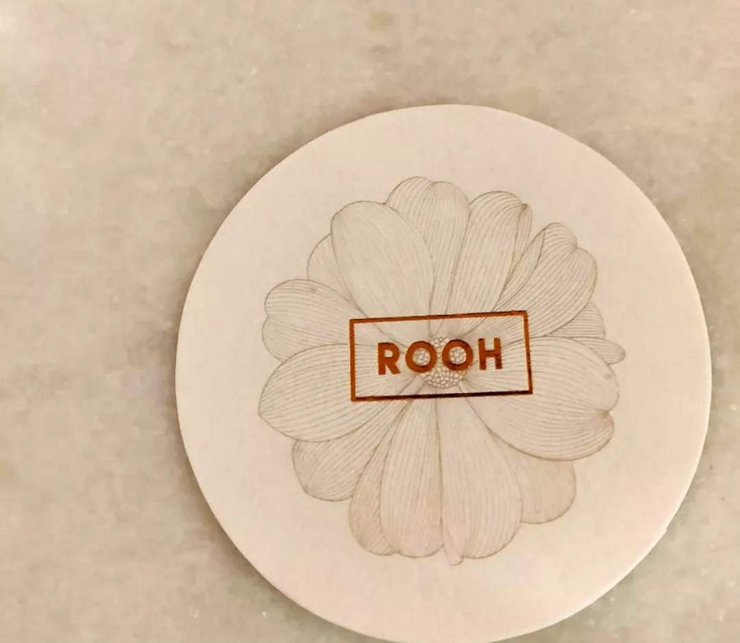 Plate,Leaf,Tableware,Font,Petal,Dishware,Beige,Plant,Label,Logo