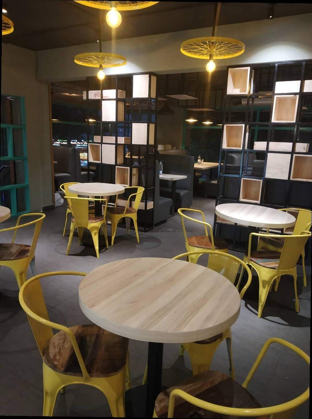 Room,Furniture,Table,Restaurant,Yellow,Cafeteria,Building,Café,Interior design,Coffeehouse