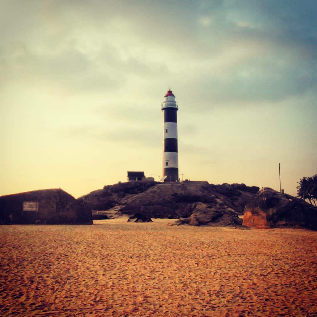 Sky,Lighthouse,Tower,Beacon,Landmark,Sea,Calm,Cloud,Horizon,Ocean