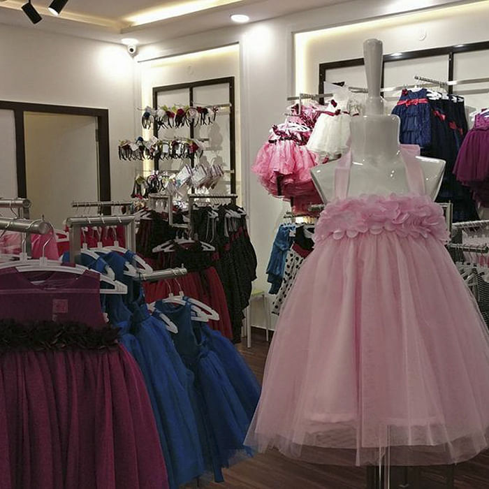 Dress,Clothing,Pink,Gown,Boutique,Fashion,Formal wear,Room,Costume design,Cocktail dress