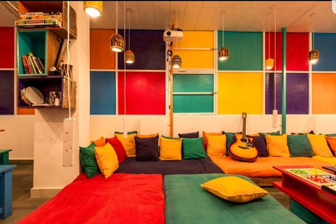 Room,Interior design,Orange,Furniture,Yellow,Building,Wall,House,Ceiling,Floor